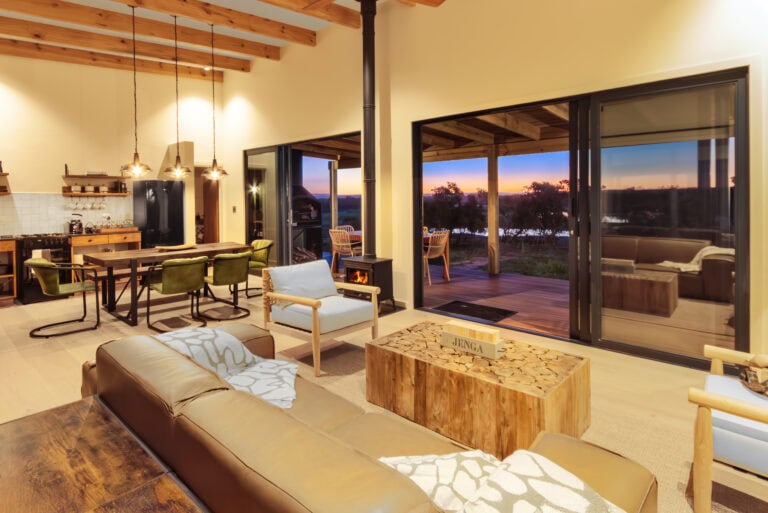 Open Lounge and kitchen with cozy fire place at the Rooikat Safari Collection on the West Coast private game reserve, near yzerfontein, the closest safari destination to Cape Town