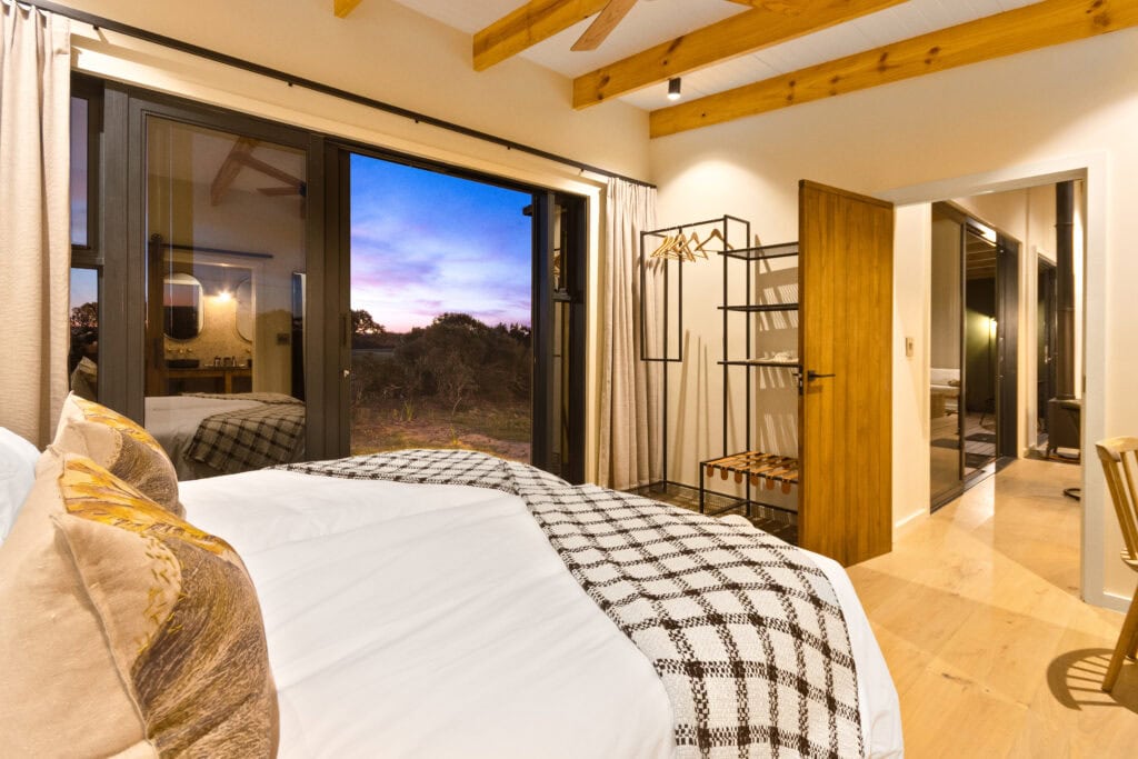 Bedroom with a view at the Rooikat Safari Collection on the West Coast private game reserve, near yzerfontein, the closest safari destination to Cape Town